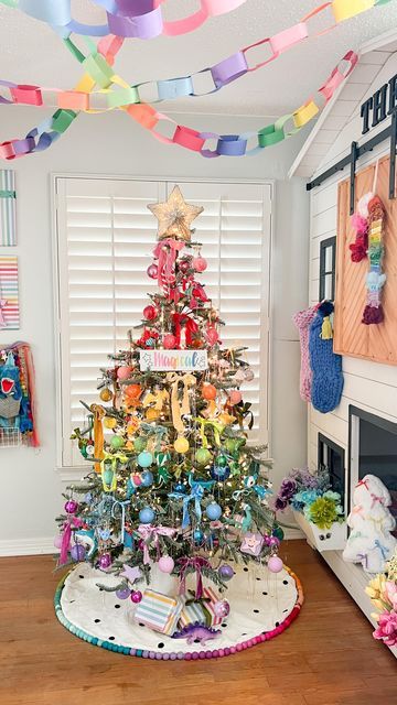 Tina Green | TheBearAndTheFawn on Instagram: "Theo’s bedroom reveal!! 🎄🌈 A rainbow holiday room for my rainbow loving boy! I’ll share a closer look at details soon, but hope you love this as much as we do! I can’t think of a happier space for the holidays💖 Tree: @kingofchristmas Candy cane wreath: @dollartree diy inspired by @ambusheedwithboys & @opal_auktober Magical sign: @chalkdesignsbyme Rainbow garland: @pearlandjane x @kelseyklos collab Tree topper: @michaelsstores Guitar: @loogguitars Flowers: @dollartree Rainbow fabric blanket : @joann_stores Velvet ribbon: @etsy and @anthropologie Stockings: @target last year #rainbowchristmas #colorfulchristmas #christmasinspiration #holidaydecor #kidsholiday #rainbow #colorfuldecor" Rainbow Baby Christmas Tree, Rainbow Christmas Tree Ornaments, Rainbow Tree Decorations, Rainbow Xmas Tree, Anthropologie Stockings, Rainbow Christmas Tree Decorations, Rainbow Christmas Decor, Playroom Christmas, Unicorn Tree