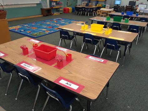 Color tables set up and ready for the First day of School. Classroom Set Up With Tables, Classroom Table Setup, Classroom With Tables Instead Of Desks, Kindergarten Classroom Table Storage, 3rd Grade Classroom Setup With Tables, Table Classroom Set Up, Preschool Table Set Up, Table Supplies Classroom, Kindergarten Class Set Up