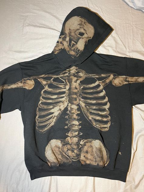 A hand painted bleach dyed sweatshirt with a skeletal design on the front, back, arms, and hood. Bleach Skull Hoodie, Bleached Sweater Ideas, Bleach Jacket Design Ideas, Back Of Hoodie Design, Bleach Design Hoodie, Skeleton Bleach Hoodie, Cool Clothing Designs, Bleaching Clothes Ideas, Bleach Skeleton Hoodie