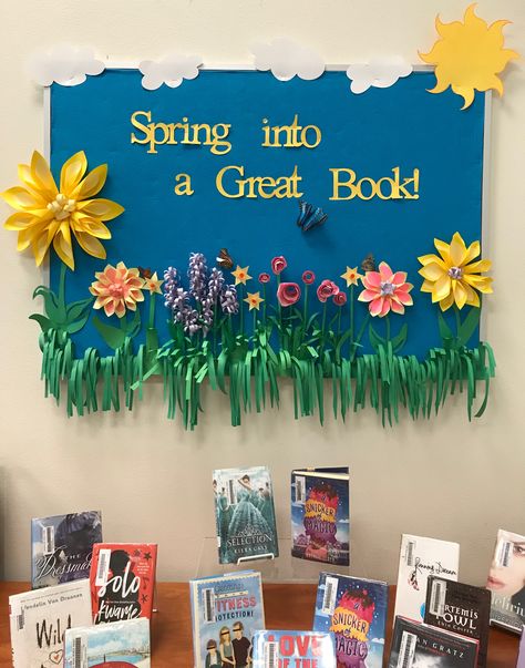 Spring library display using paper flowers. Summer Reading Library Displays, Spring Window Display Ideas School, Spring Decorations For Office, Spring Class Decorations, Spring Tree Bulletin Board Ideas, Spring School Board, Spring Into Reading Bulletin Board, Library Display Ideas School, Spring Posters For School