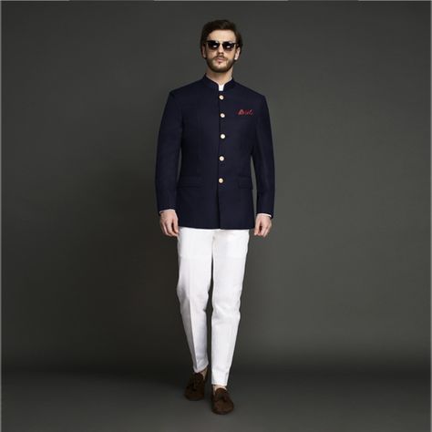 This Navy Blue Jodhpuri Suit will be the best investment you will make as you can wear it both at work as well as for weddings. The Jodhpuri coat is tailored from Super 120s Italian wool fabric, darted for a superior fit and paired with white pants. The suit has luxurious hand painted buttons from Jaipur. #indianwedding #jodhpurisuitwedding #indiangroomattire #bandhgalasuit #indiangroom #desiwedding #menscustomsuit #affordableluxury #instawedding #indianweddinginspiration #bluejodhpuri Navy Blue Bandhgala Suit, Blazer For Wedding, Indian Formal Wear, Prince Suit, Jodhpuri Suits, Mens Indian Wear, Jodhpuri Suit, Prince Coat, Ethnic Suit