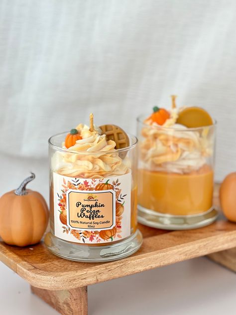 Our Natural Pumpkin Pecan Candle will remind you of autumn, pumpkin picking & those nostalgic fall vibes. This unique fragrance has a cinnamon & cherry infusion which combines on a savory vanilla & maple syrup base. The candle provides that signature pumpkin pecan aroma, that mixes well with a sugary apple hint. Scent Notes: Top - Butter Middle - Cinnamon, Apple, Cherry Bottom - Vanilla, Musk, Maple Syrup This candle also has a 3D pumpkin and waffle on top and whipped frosting that is made of wa Fall Themed Candles, Candle Frosting, Nostalgic Fall, Fall Candle Decor, Autumn Candles, Apple Candle, Pecan Desserts, Dessert Candle, 3d Pumpkin