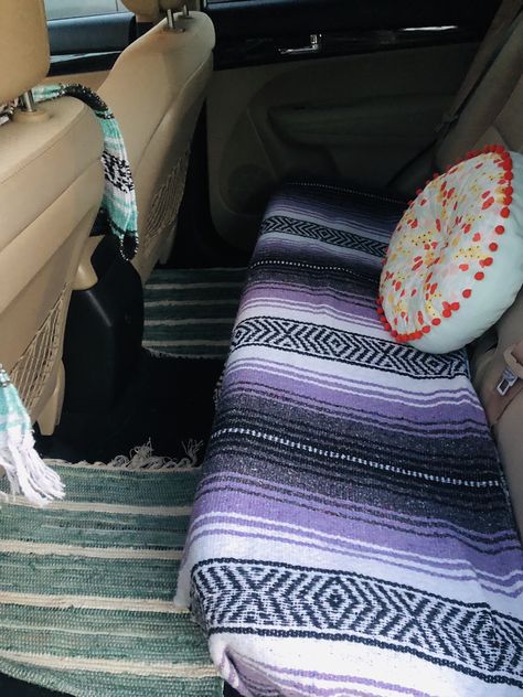 Got the blankets on amazon $15!! Pillow at target for $5!!! Floor Rugs @ World Market!!! $10! Car Backseat Pillows And Blankets, Car Decor Backseat, Car Rugs Vehicles, Boho Car Ideas, Tapestry In Car Roof, Aesthetic Truck Interior, Car Accessories Aesthetic Boho, Car Blanket Aesthetic, Witchy Car Interior