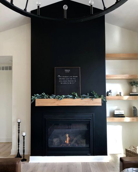 35 Amazing Black Fireplace Ideas To Inspire You Right Away Black Electric Fireplace Living Room, Black Wall Wood Mantle, Black Drywall Fireplace, Black Fireplace With Taupe Walls, Art Wall With Shelves, White Walls With Black Fireplace, Dark Fireplace Accent Wall, Black Fireplace Design, Black Stone Fireplace Wall