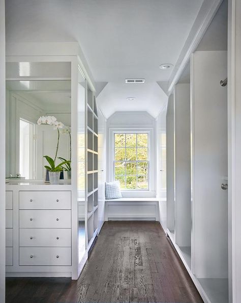 White walk in closet features a nook filled with a built-in dresser with inset drawers under a mirror facing a wall of stacked tension rod clothes rails. Closet Window, Built In Window Seat, Master Closet Design, Built In Dresser, Closet Built Ins, Wardrobe Room, Closet Remodel, Dream Closets, غرفة ملابس