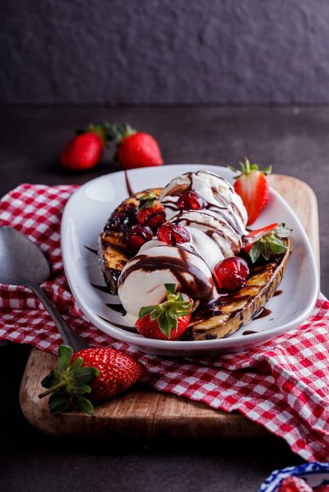 Grilled bananas take the classic banana split to new levels paired with vanilla ice cream, fresh strawberries, whipped cream & the ultimate hot fudge sauce. #dessert #grilling #summer #easyrecipe Banana Split Sundae, Banana Sundae, Banana Splits Sundae, Summertime Desserts, Strawberries Whipped Cream, Grilled Bananas, Roasted Banana, Cream Fresh, Hot Fudge Sauce