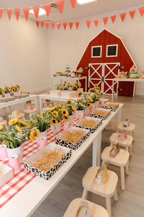 This birthday party exuded the farm theme to a tee. The blank raw space had a large red farm barn door installation, yellow sunflowers that lined each petite table and sweet treats in the shape of animals. The intricate details provided by Evoke Design and Creative made this party sensational, right down to the hay bale decor. Hay Bale Decor, Barn Birthday Party, Farm Party Decorations, Animal Themed Birthday Party, Animal Theme Birthday, Barn Door Installation, Farm Theme Birthday, Farm Animals Theme, Farm Animal Party