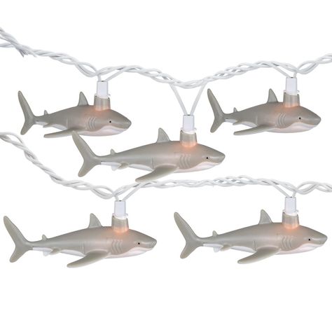 Light up your outdoor space with this unique patio light set. This whimsical light set features adorable gray and white shark-shaped lights, creating a fun and playful atmosphere. Perfect for poolside gatherings, beach-themed parties, or simply adding a touch of marine-inspired decor to your patio, these lights are sure to make a splash. Product Features: Shark novelty patio lights Bulb color: clear bulbs / white wire Bulb size: mini Number of bulbs on string: 10 Spacing between each bulb: 8" Li Shark Patio, Shark Themed Items, Shark Home Decor, Shark Things To Buy, Shark Lights, Shark Theme Room, Cool Stuff For Your Room, Shark Room Decor, Shark Items