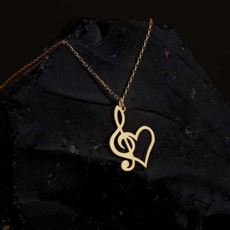 "Treble Clef Necklace with Heart is made by hand in our workshop with care. All our jewelry is the most elegant choice for the Bridesmaids, friends, your loved ones and for yourself. Treble Clef Necklace with Heart * Material: High Quality Solid 925 Sterling Silver. * Dimensions: Depending on your font choice, height sizes range from 1,5 mm to 3,5 mm lowercase. * Finish: Sterling Silver ∙ Gold ∙ Rose Gold. HOW TO ORDER ❓ * Select your necklace COLOR. * Choose necklace length from 14\" to 22\". T Music Necklaces, Musical Note Jewelry, Music Themed Jewelry, Treble Clef Necklace, Music Necklace, Flower Resin Jewelry, Necklace With Heart, Musical Jewelry, Music Accessories