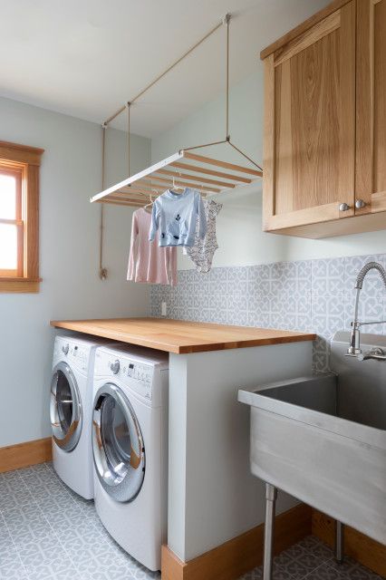 Pros Share 8 Laundry Room Must-Haves Ceiling Drying Rack, Laundry Inspiration, Utility Room Organization, Laundry Room Decor Ideas, Transitional Laundry Room, Small Utility Room, Second Story Addition, Custom Laundry Room, Compact Laundry