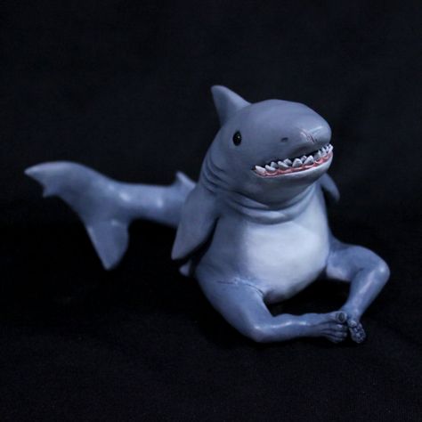 He's a simple shark with legs making his way through life, just like the rest of us. When he's happy, he wiggles his toes. This dude is a runt, only 2.5 inches tall, but what he lacks in size, he makes up with teeth (and spirit!). He is hand made with Cos Clay, giving him a little bit of flexibility which helps prevent any breakage. He may look tough, and he is, but this is not a toy. Shark Sculpture Clay, Whale Shark Clay, Shark Clay Sculpture, Simple Clay Art, Clay Shark, Shark Meme, Shark Toys, Shark Sculpture, Aquarium Pictures