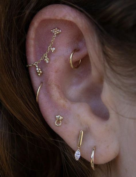 Earring Stacks Both Ears, Earring Curation Gold, Dainty Ear Styling, Dainty Gold Piercings, Gold Earring Curation, Gold Earscapes, Interesting Ear Piercings, Mixed Metal Ear Piercings, Ear Piercing Stacking Ideas