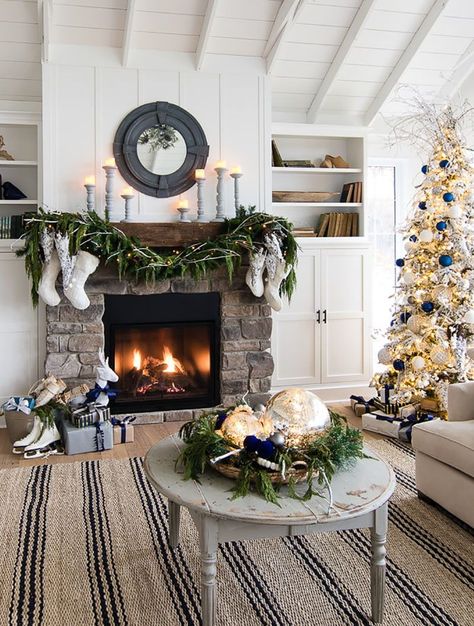 Capture the look of wintry-rustic elegance in your home by decorating your Christmas trees with a winter wonderland theme. Lake House Christmas, House Christmas Decor, Christmas Rooms, Fireplace Renovation, Lilypad Cottage, Christmas Fireplace Mantels, Christmas Fireplace Decor, Christmas Board, Christmas Mantel Decorations