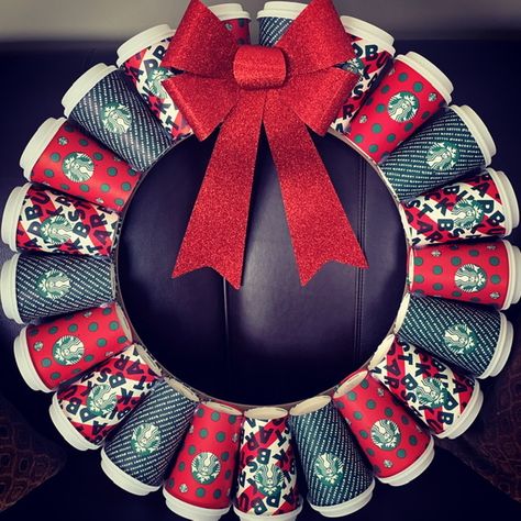 Collected 2019 Starbucks Christmas cups to make a wreath.  Composite wreath form and hot glue was the best method. Added a glitter bow from a clearance rack.  Love it! Coffee Cup Wreath, Starbucks Cup Wreath, Starbucks Christmas Decorations, Starbucks Wreath, Coffee Shop Christmas Decor, Cup Wreath, K Cup Crafts, Xmas Lanterns, Starbucks Crafts