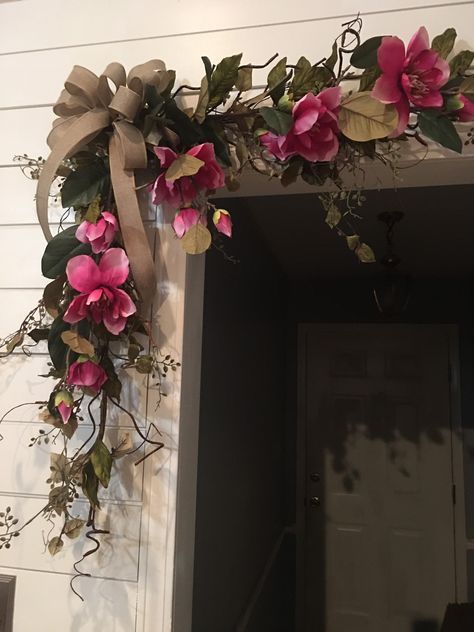 "Beautiful artificial leaves and twigs and a faux burlap bow make up this elegant corner swag or garland. Order as a single swag (1 corner) or a set of 2. Sits into a command hook placed onto wall. Each leaf and branch is wired and can be extended or compacted. Also available with artificial fuchsia magnolias. Choose \"with magnolias\" or \"greenery only\". Check out matching decor: https://etsy.me/3xYYLIV https://etsy.me/3Ku4GIx https://etsy.me/3klzqRB https://etsy.me/3OMHFUW https://etsy.me/3v Doorway Garland, Front Door Garland, Door Garland, Single Swag, Kitchen Table Makeover, Artificial Leaves, Burlap Bow, Greenery Garland, Artificial Leaf