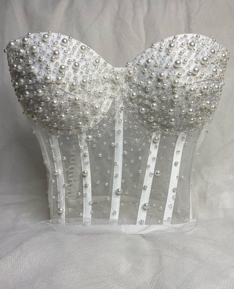 Featuring intricate rhinestones and beadwork, this stunning corset top is perfect for any special occasion. The back is designed with adjustable lace-up ties, ensuring a perfect fit every time. Each piece is custom-made with love and crafted to perfection. Order yours today and shine bright! Korsett Top, Bridal Crop Top, Wedding Corset, White Corset Top, Taylor Outfits, Top Bustier, Rhinestone Top, White Corset, People Clothes