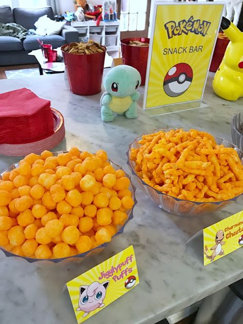 Pokémon snack bar for a Pokémon-themed birthday party. Click or visit FabEveryday.com to see details and DIY instructions for a Pokémon or Pokémon Go themed kid's party, including printables, food, decorations, favors, and party activities. Pokemon Party Food, Diy Pokemon Party, Pokemon Birthday Party Ideas, Pokemon Snacks, Diy Pokemon, Pokemon Themed Party, Food Decorations, Pokemon Birthday Party, Pokemon Theme