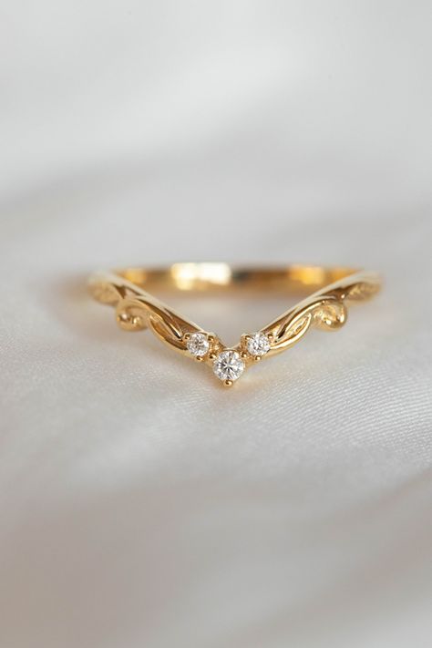 This listing is for WEDDING BAND ONLY. For the complete bridal ring set you could add this engagement ring - https://www.etsy.com/listing/1335866250/real-moonstone-ring-diamonds-and-gold This nature wedding band features delicate design with realistic looking leaves  and three diamonds. Gemstones are placed on a textured shank and gives a nice sparkle. It is a dainty jewelry piece but sturdy enough for everyday wear. Suitable as woman's wedding band and unique engagement ring as well. It goes pe Womens Unique Wedding Bands, Pear Ring Wedding Band, Wedding Band Styles For Women, Wedding Band And Engagement Ring Pairing, Wishbone Wedding Ring, Pear Wedding Band Set, Women’s Wedding Bands, Wedding Bands For Women With Engagement, Wedding Ring Pair