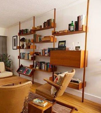 Mid-century, teak veneered tension pole shelving unit. Diy Mid Century Shelving, Mid Century Modular Shelving, Diy Mid Century Shelves, Mid Century Modern Wall Shelf, Mid Century Basement Ideas, Living Room Shelving Unit, 70s Shelving, Midcentury Modern Shelves, Midcentury Modern Office Ideas