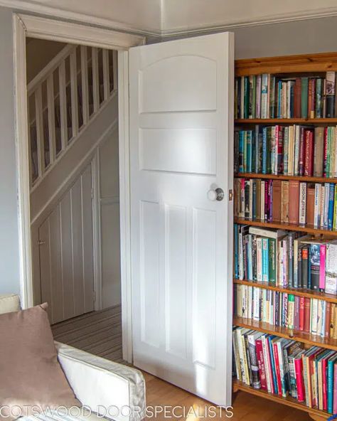 A tasteful 1930s bespoke internal door painted white and fitted with a white porcelain door knob. Made in hardwood for stability, the door features five recessed flat panels including a classic arched panel at the top. Its clean lines and minimalist appearance are typical of interior design for this era, where strong geometric shapes were in favour. Installed in an stylish dove-grey living room with a traditional picture rail. 1930s Doors Internal, 1930s House Interior Original, 1930s Internal Doors, 1930s Doors, 1930s Living Room, 1930s House Interior, Two Panel Doors, Internal Oak Doors, Porcelain Door Knobs