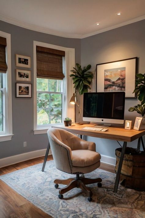 When setting up your cozy home office, think about adding plush seating like a comfy armchair or sofa. Use soft textiles, including a fluffy rug, throw pillows, and a blanket, to layer the area. Add personal items, like framed artwork, family photos, or a small bookshelf, to make it uniquely yours. Cozy Office Space With Couch, Desk With Rug Under, Home Office Gray Walls, Small Office With Tv, Small Office Ideas No Windows, Living Room With Desk Area Layout, Cozy Modern Office, Office And Reading Room Ideas, Desk In Bay Window