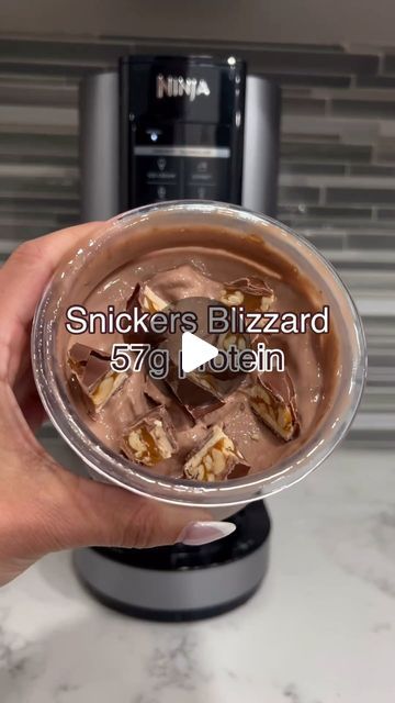 Ninja Creami Recipes | High Protein | Ice Cream on Instagram: "Comment ‘PROTEIN’ for the delicious creamy hot chocolate protein used 😋  Video Credit: @minnyhustlers   Follow @creamiwrld for more daily recipes!  Try this homemade Snickers Blizzard with your Ninja Creami and let us know what you think! 🤤🤤🤤🤤  Macros for the base: 57g of protein, just 14g of carbs, and 6g fat for a total of 333 calories - this treat doesn’t just taste indulgent, it fuels your gains too! 😤💪  Toppings? Go ahead, treat yourself; you’ve earned it. 🌟  #HighProtein #NinjaCreamiRecipe #NinjaCreami" Ninja Creami Snickers, Chocolate Protein Ninja Creami, Blizzard Recipe, High Protein Ice Cream, Hot Chocolate Protein, Snickers Protein, Ninja Creami Recipes, Recipes High Protein, Creamy Hot Chocolate