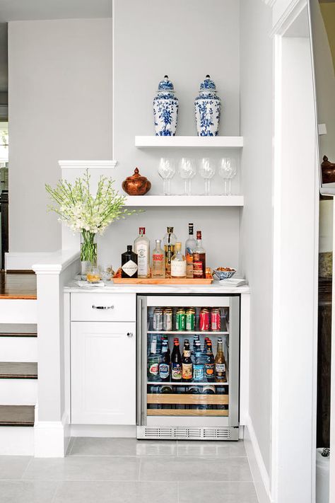 Take Advantage of Nooks and Crannies - 50 Best Small Space Decorating Tricks We Learned in 2016 - Southernliving. In a small area, no corner should go to waste. This nook offers an efficient use of space by adding a refrigerator for drinks, shelving for storing glasses, and a marble-topped counter to corral a small bar and mix up cocktails. It adds party and prep space to a small kitchen. Bar Nook, Bar Mini, Bar Sala, Cheap Ideas, Home Bar Designs, Mini Bars, Wet Bars, Design Seeds, Apartment Decorating