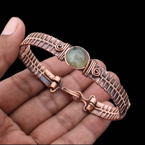 Prehnite Cuff Bracelet Copper Wire Wrapped Bangle Bracelet Handmade Bangle Cuff Gemstone Bracelet Prehnite Bracelet Wire Wrapped Jewelry Main Stone - Prehnite Bangle Length - 2.50 - 2.75" Inches (Adjustable) Bangle Width  -  0.50 Inches Metal                  -  Copper Copper Has Been Used For Jewelry Making For Thousands Of Years, Dating Back To Ancient Civilizations Such As The Egyptians, Romans, And Aztecs. Copper Was Valued For Its Beauty, Versatility, And Durability, And Was Often Used To M Link Bracelets Handmade, Copper Bracelets Handmade, Copper Bracelet Benefits, Wire Jewelry Diy Tutorial, Wire Bracelet Tutorial, Antique Copper Jewelry, Handmade Copper Bracelet, Wire Wrapped Bangles, Bijoux Fil Aluminium