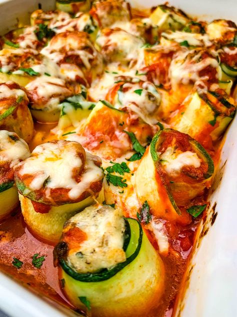 Easy, Zucchini Lasagna Roll Ups is the best recipe for veggie rolls stuffed with ricotta, cream cheese, and meat. This dish is keto-friendly and smothered in marinara and gooey melted cheese. You can serve it with zucchini noodles if you prefer. #ZucchiniLasagna #KetoRecipes #KetoLasagna Zucchini Lasagna Roll Ups, Easy Zucchini Lasagna, Lasagna Roll Ups Recipe, Lasagne Roll Ups, Zucchini Hummus, Zucchini Lasagna Rolls, Veggie Rolls, Zucchini Ravioli, Zucchini Rolls