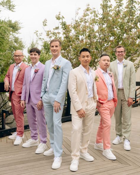 Captured the stylish vibes of Jeff and Ben’s spring wedding at the @gurneysresorts with their dapper groomsmen in colourful pastel suits. Photographer: @khatleen.photography Videographer: @bradyweddings @thebrothersgorman @angelo.rigogliosi Florist: @jennywildflower Makeup: @mariaortegamakeup Grooms’ Suits: @dior Groomsmen Suits: @indochino @indochinoweddings Grooms Man Suits Wedding Ideas, Garden Party Suit Men, Bright Groomsmen Attire, Colourful Groom Suit, Wildflower Wedding Groom Suit, Colorful Bridal Party Groomsmen, Groomsmen Pastel Attire, Groomsmen Attire Different Colors, Pastel Suits Men