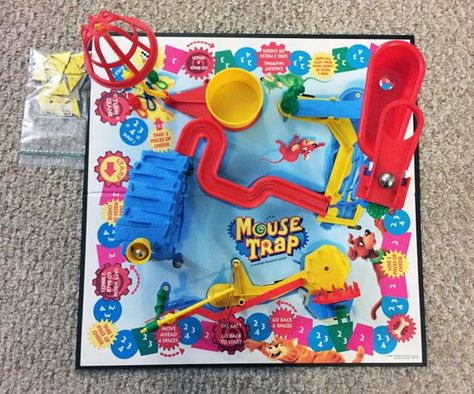 Mouse Trap- Board Game- Milton Bradley/Hasbro. 100% Complete (1994). Game parts are all in good condition. We have a bunch of these in stock. All games are 100% complete. Please select condition when purchasing. Conditions are as follows..Excellent: Very light signs of use, excellent condition box.Great: Game box has some wear or taped corners.Good: Split edges, clear taped corners, small marks on box (game is still 100% complete). Re-print directions."The crazy game with 3 all action contraptio Mouse Trap Game Decorations, Mouse Trap Board Game, Mouse Trap Game, Crazy Games, Mouse Trap, Mouse Traps, 90s Toys, Game Collection, Milton Bradley