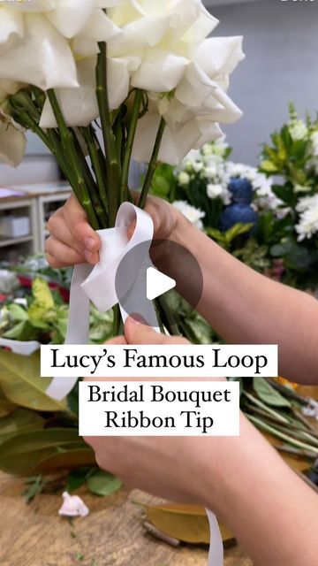 SYDNEY FLORIST • SYDNEY FLOWER DELIVERY • FIVE GENERATIONS 💐 on Instagram: "TIP FOR FLORISTS ✨💫 Watch for a super simple way to ribbon your next bridal bouquet. Using this loop technique means you have no bulky knot when you tie it off. It looks so neat wrapped around the stems.

😆 Disclaimer:  I put Lucy on the spot for the name of this! There may be lots of you using this technique, she’s just famous in our store amongst our florists because we hadn’t seen it before and she’s taught everyone!

😊 Any questions just ask x

#floristtip #floristhack #bouquetribbon #weddingflorist #weddingtip #flowersofspring #sydneyweddings #whiteroses #ribbon" How To Make A Simple Bridal Bouquet, Wrapping Ribbon Around Bouquet, Bridal Bouquet Ribbon Wrap, How To Tie Bouquet With Ribbon, How To Wrap Ribbon Around Bouquet, Dance Bouquet Ideas, How To Tie Ribbon On Bouquet, How To Wrap A Bouquet With Ribbon, Wedding Bouquet Ribbon Wrap