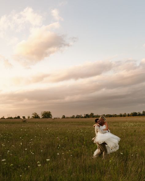 this wedding is my roman empire. happy one year to the Kaminski’s!🕊️  backyard wedding, wedding photos, bride, bridal, etheral couples photos, poses for bride and groom, summer wedding, travel elopement photographer, michigan wedding photographer, golden, cottage core wedding dress, romance, white flowers, documentary photography Bride And Groom Field Photos, Open Field Wedding Photography, Wildflower Wedding Photos, Wedding Photos In A Field, Wedding Photos Farm, Micro Wedding Photos, Wedding Photos Field, Cottage Core Photography, Whimsical Wedding Photos