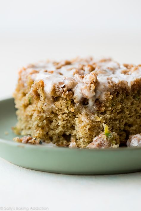 Zucchini crumb cake is moist, spiced with cinnamon, topped with brown sugar crumble, and sweet vanilla icing! You can't even tell you're eating your veggies! Delicious coffee cake recipe on sallysbakingaddiction.com Zucchini Snack Cake, Zucchini Coffee Cake, Crumb Cake Muffins, Zucchini Recipes Dessert, Sallys Baking, Crumb Cake Recipe, Sally's Baking, Vanilla Icing, Zucchini Bread Recipes