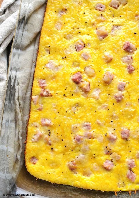 Easy Ham Egg and Cheese Casserole Spam And Egg Casserole, Hashbrown Egg And Cheese Casserole, Ham Scrambled Eggs, Brunch Egg Casserole Recipes, Easy Egg Bake For A Crowd, Ham Eggs And Cheese Casserole, Ham Egg And Cheese Breakfast Sliders, Eggs And Ham Casserole, Breakfast Ideas To Reheat