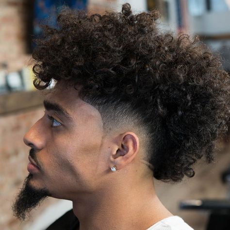 Boys and girls applying different colors to their hairs and enhancing their style game.Recently the black guys with blonde hairs are raising quite a few eyebrows.To know more https://bit.ly/2CDFBN0 #blackguyswithblondehairs #Fashionterest Burst Fade Mohawk, Curly Mohawk Hairstyles, Types Of Fade Haircut, Curly Afro Hair, Mohawk Haircut, Mohawk Hairstyles Men, Curly Mohawk, Curly Hair Fade, Tapered Haircut