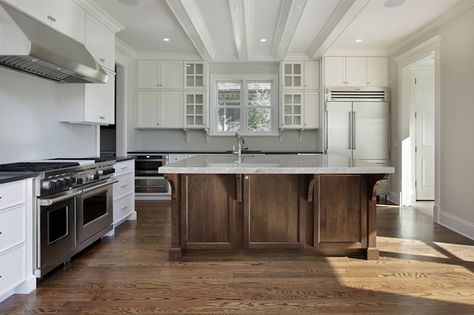 Fantastic L-shaped kitchen with ceiling height white perimeter cabinetry paired with nickel hardware and sleek black countertops. All White Kitchen, White Kitchen Design, 3 Light Chandelier, Gallery Design, Studio Design, Bar Counter, Kitchen Remodeling, Design Gallery, White Cabinets