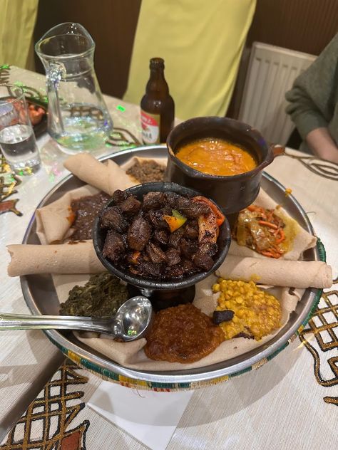 Discover the flavors of Ethiopia in London with our guide to the top Ethiopian restaurants in the city. From traditional stews to vegan options, we've got you covered for a delicious dining experience. #londonfoodguide #londonrestaurants | Places To Eat In London | Ethiopian Restaurants In London | African Restauarants In London | London Food Scene | Unique Places To Eat In London | Quirky Places To Eat In London #london #brixton #camberwell #camden #kentishtown #finsburypark #northlondon London Brixton, Places To Eat In London, Ethiopian Restaurant, Eat In London, London Kensington, Restaurants In London, Kensington London, City Restaurants, London Food