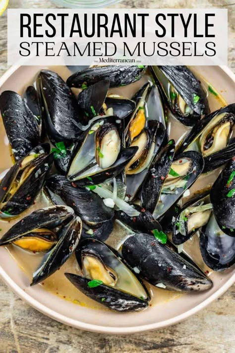 Tender steamed mussels in a white wine broth is an easy and irresistible recipe! Get all the tips for how to buy, clean, and cook mussels. Mussels Recipe White Wine, Mussels Recipes, Mussels In White Wine, Cooking Mussels, Steamed Mussels, Mussels Recipe, The Mediterranean Dish, White Wine Sauce, Muscle Food