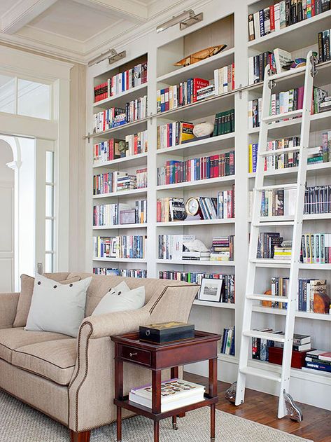 For a large book collection, tilt books in different directions to make the entire bookcase look more visually interesting. Books can be stacked horizontally on top of one another, vertically, and even lean at an angle to add visual rhythm to a bookcase filled to the brim. Bookshelf Ideas, Library Bookshelves, Wood Details, Library Shelves, Home Library Design, Living Room Shelves, Home Libraries, Book Shelves, Built In Bookcase