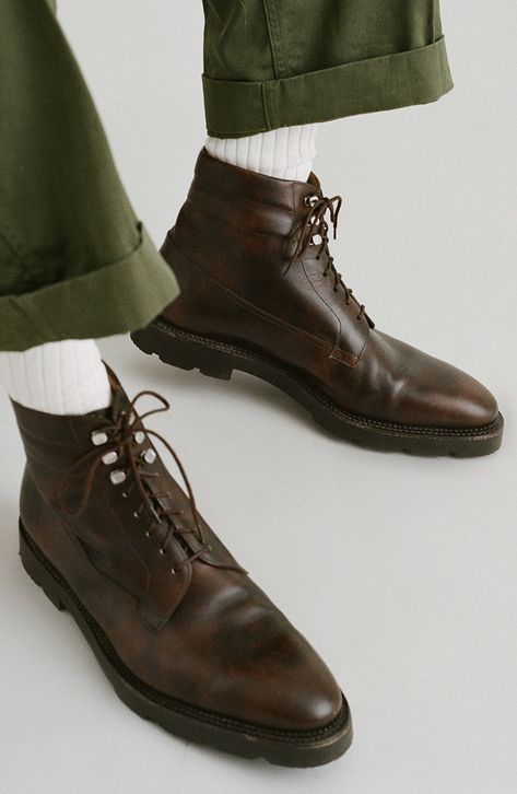 Refined materials and impeccable craftsmanship elevate a lace-up boot inspired by an archival 1940's ski boot and set on a lightweight lug sole. Lace-up style Leather upper and lining/rubber sole Made in the UK Men's Designer Shoes