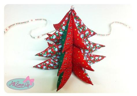 "Use up your Christmas fabric scraps to sew this 3D Christmas tree. This three-dimensional patchwork Christmas tree can stand up by itself to be displayed on a shelf, or you could add a ribbon to the top and hang it up." Sewing Christmas, Christmas Patchwork, 3d Christmas Tree, Christmas Sewing Projects, Fabric Tree, Sewing Projects Free, Fabric Christmas Trees, Navidad Diy, Fabric Christmas Ornaments