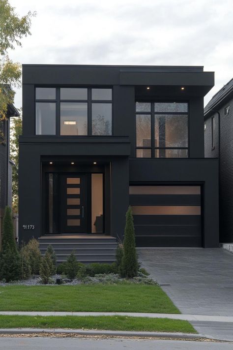 Modern black stucco house facade with bold architectural lines. Check out all of these sleek and stylish dark modern house ideas that blend sophistication with a touch of mystery. Modern Contemporary Exterior House Colors, Modern New Build House, 2 Story Contemporary House Exterior, Minimalist House Design Plan, Modern 3 Story House Exterior, Black Building Exterior, Concrete House Design Exterior, Black Stucco House, Black Stucco House Exterior