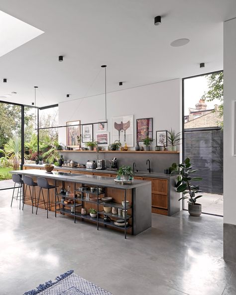 Welcome to Cloak House. Our kitchen worktop and island are the heart of this stunning space. All pre-cast in our factory, the worktop, island, splashback and end panels were all cast in our Platinum Grey colour to beautifully connect them with the polished concrete floor. The matching floor in Light Natural covers 100m2, inside and out. #InteriorDesign #ResidentialArchitecture #ConcreteFlooring Factory Kitchen Design, Grey Polished Concrete Floor, Poured Concrete Kitchen Floor, Cement And Wood Kitchen, Polished Concrete Floor Kitchen Modern, Concrete Finish Kitchen, Kitchen Ideas Concrete Floor, Concrete Floor Kitchen Ideas, Polished Concrete Floor Interior Design