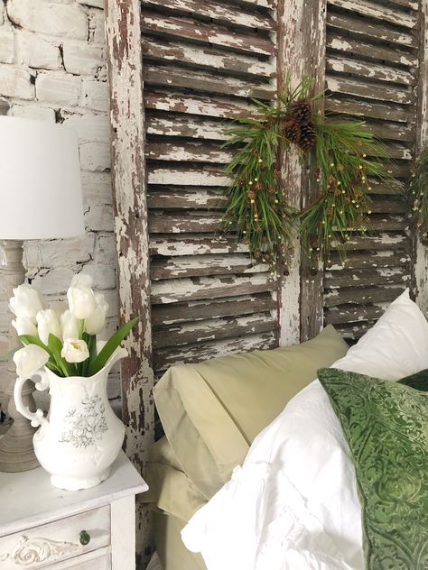 How we made our antique shutter headboard and decorated it, too! Old Louvered Door Ideas Repurposed, Headboard Made From Old Windows, Louvered Door Ideas Repurposed, Window Headboard Ideas, Shutter Headboard Ideas, Old Window Headboard, Old Shutters Decor, Shutter Headboard, Shutters Bedroom