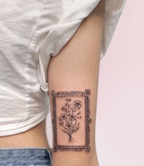 Frames Tattoo Design, Simple Back Of Arm Tattoo, Unique Women Tattoos Inspiration, Vintage Patchwork Tattoo, Framed Flowers Tattoo, Simple Vintage Tattoo, Picture Frame Tattoo Design, Framed Floral Tattoo, Tattoo Picture Frame