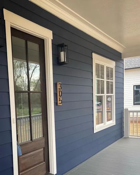 Blue Exterior Ranch House, Naval Exterior House, Dark Blue Ranch House, Sherwin Williams Blue Exterior House, Sherwin Williams Naval Exterior House, Dark Blue House Exterior With Wood Farmhouse, Dark Blue Cottage Exterior, Navy And White House Exterior, Sw Naval Exterior House