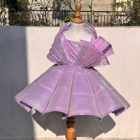 "Introducing our stunning purple structured dress, crafted from sequined fabric. This beautiful dress is ideal for birthday outfits, making every celebration special. Perfect as a kid's dress, it adds a touch of elegance to any child wear collection." #celebrity #kid #dress #DesignerWear #devydesigns #devy #luxuryfashion #likeforlikes #explorepage #TrendyKids #treandingreels #Glam #grow #viralreels #photooftheday #Fashionista #MomDaughterTwinning Birthday Outfit For Baby Girl, Birthday Frocks, Kid Dress, Sequined Fabric, Children Dress, Sewing Clothes Women, Structured Dress, Girls Couture