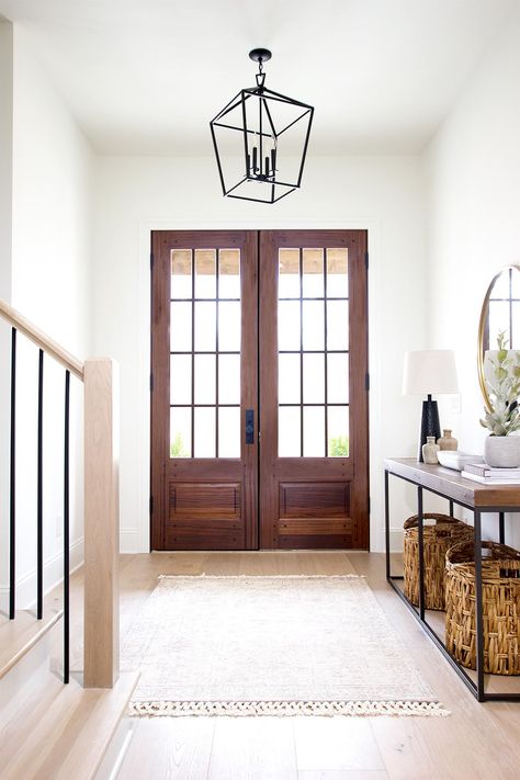 Choosing your style will help you choose the type of fixture, but it may even help narrow down the material you would like. A farmhouse look may be more black metals and woods. This isn’t always the case but it is true most of the time. Narrowing down the material/color can quickly eliminate some choices and make the process easier. #wooddoors #entryway #door #frontdoor Entry Light Fixture, Entryway Light Fixture, Plank And Pillow, Interior Front Door, Entryway Light Fixtures, Entrance Lighting, Prefinished Hardwood, Beautiful Front Doors, Entry Lighting