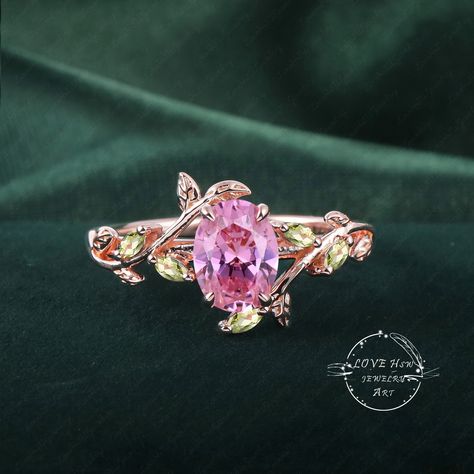 Art Deco Oval Pink Sapphire engagement ring Bridal Ring Rose Gold Unique Leaf Nature Inspired Pink Gemstone Promise Cluster ring jewelry (Please comfirm your US size when you make an order) Jewelry details: Matal Type: 14k gold /18k gold Engagement Ring: Center Stone:  Lab pink sapphire Stone Size: 6*8mm Side stones: peridot Total weight: 0.18ctw (High Quality) Wedding band Moss Agate and moissanite Carat Weight: approx. 0.182ctw Or: black sapphire (If you choose side stone in black sapphire) Purchase Guarantee: 1: Provide you with the best service. 2: 14 Day Refund Guarantee. 3: Free Gift Box&Packing 4: Free Shipping and insurance to All Parts Of The World. Accessories: beautiful Ring box, and little gifts. Processing time: When we receive payment We need 2-3 weeks to work for your items Pink And Green Ring, Hot Pink Wedding Shoes, Pink Engagement Rings, Pink Tourmaline Engagement Ring, Whimsical Ring, Pink Sapphire Engagement Ring, 18k Gold Engagement Ring, Pink Wedding Rings, Pretty Engagement Rings